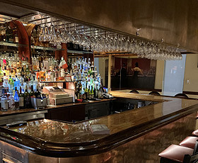 Enjoy a cocktail at our classic bar at Pasquale's Rigoletto on Arthur Ave